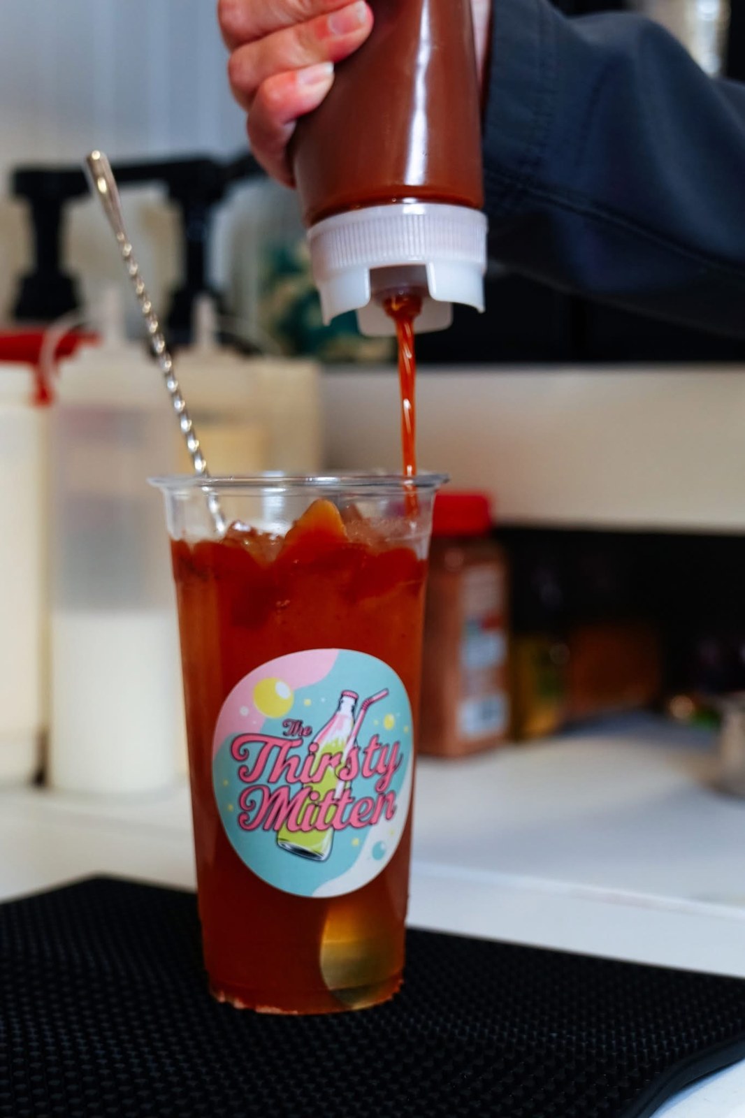 Syrup being added to a made-to-order drink